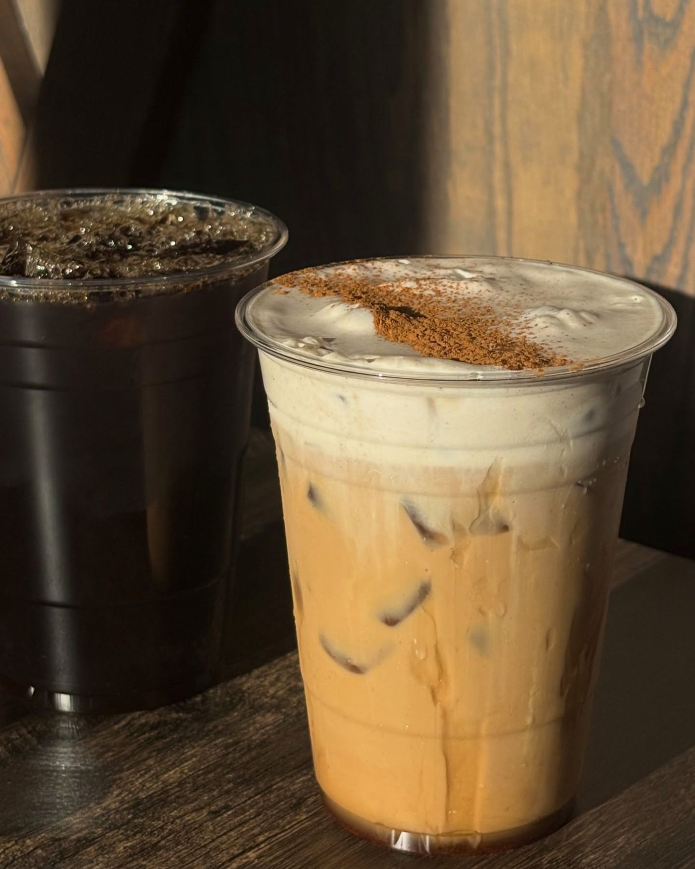 Two iced drinks in the late afternoon light